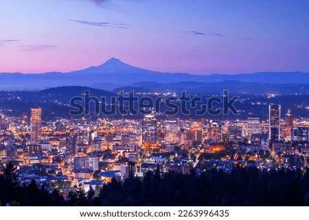 Portland, Oregon, USA skyline at dawn with Mt. Hood in the distance at dawn.