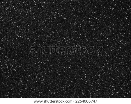 Black sparkling shiny glitter. Design pattern dark texture for decoration and design of unusual, extravagant Christmas, New Year, xmas gift card or other holiday pictures. Beautiful packaging material