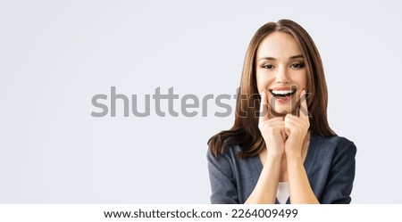 Dental dent health care ad concept picture - brunette beautiful woman in casual cloth show white toothy smile. Portrait image of happy girl, isolate bright gray wall background wide banner composition