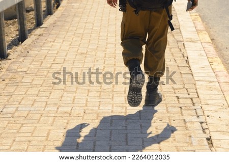 Israeli soldier without a face. Only boots. Soldier walking on asphalt. Soldiers IDF - Israel Defense Forces (Tzahal), IsraelI soldiers, Israeli army 