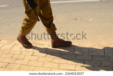 Israeli soldier without a face. Only boots. Soldier walking on asphalt. Soldiers IDF - Israel Defense Forces (Tzahal), IsraelI soldiers, Israeli army  Royalty-Free Stock Photo #2264012037