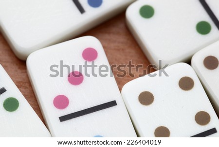 dominoes on a wooden background