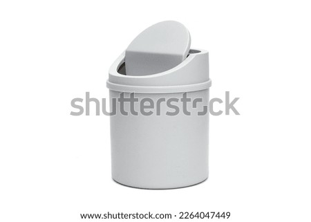 Small gray trash can isolated on white background, office paper bucket Royalty-Free Stock Photo #2264047449