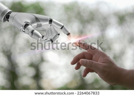 Robot hand making contact with human hand. AI, Machine learning, Hands of robot and human touching on big data network connection. artificial intelligence technology, innovation and futuristic. Royalty-Free Stock Photo #2264067833