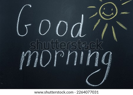 Inscriptions and phrases in chalk on a blackboard. Good morning. Royalty-Free Stock Photo #2264077031