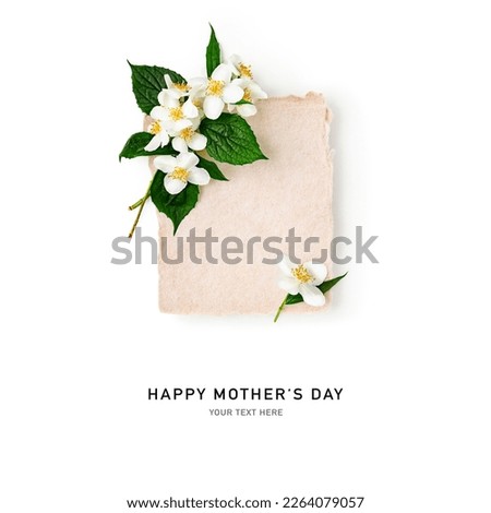 Spring jasmine flowers with paper card. Flowers, leaves and blank note isolated on white background. Happy mothers day. Design element. Creative layout. Copy space. Top view, flat lay
 Royalty-Free Stock Photo #2264079057