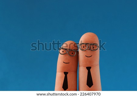Two smiling business men - successful teamwork - funny finger people