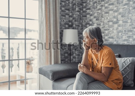 Face of senior caucasian hoary woman looking away deep in sad thoughts feels lonely close up portrait, recollect memories and life moments, depressed grandmother alone indoors, yearning for husband  Royalty-Free Stock Photo #2264099993