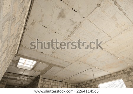 Construction of an individual residential building, monolithic interfloor reinforced concrete floor with an opening Royalty-Free Stock Photo #2264114565