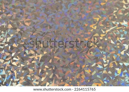 silver rainbow holographic foil texture, colorful hologram surface. Royalty-Free Stock Photo #2264115765