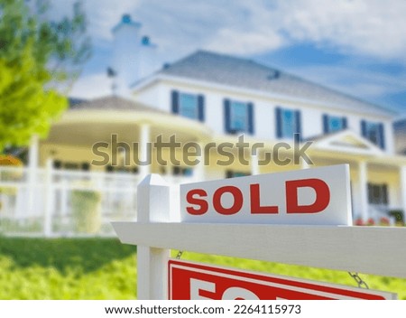 Sold For Sale Real Estate Sign in Front of New House.