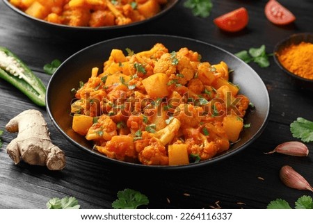Aloo Gobi traditional Indian dish with cauliflower and potato Royalty-Free Stock Photo #2264116337
