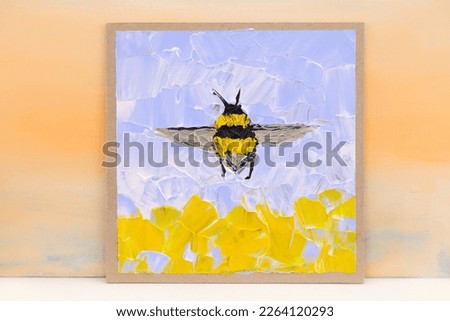 Bumblebee painting. Bumblebee in flight over the field. A simple landscape of the sky. Yellow impasto texture