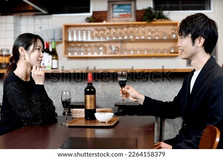 Asian women and men (couples) who enjoy drinking and eating with a smile
 Royalty-Free Stock Photo #2264158379