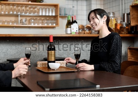 Asian women and men (couples) who enjoy drinking and eating with a smile
 Royalty-Free Stock Photo #2264158383