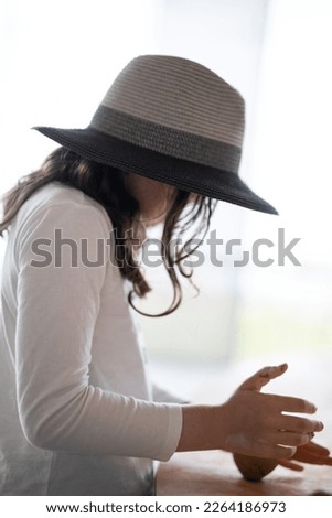 View of a woman wearing a hat