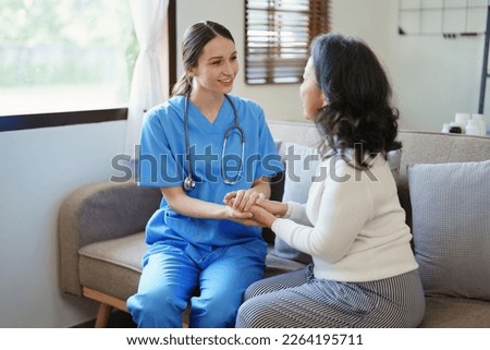 Portrait of a female doctor holding a patient's hand to encourage the fight against disease
