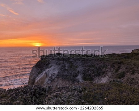sunset over the Pacific Ocean, sunset in Half Moon Bay State Beach cliff side landscape