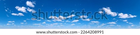 Blue Sky background with tiny Clouds. Panorama background Royalty-Free Stock Photo #2264208991