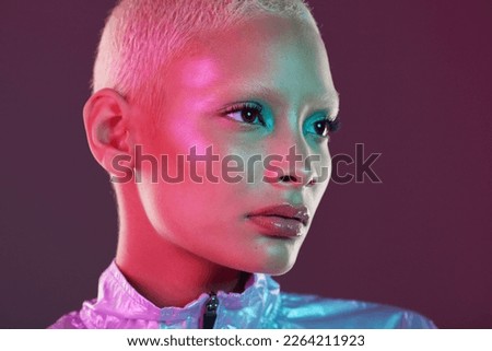 Vaporwave profile, black woman and cyberpunk cosmetics with model thinking in a studio. Isolated, glow makeup and futuristic cyber fashion of a young person with chrome clothing and scifi design