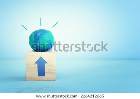 Globe model on wooden table and blue background