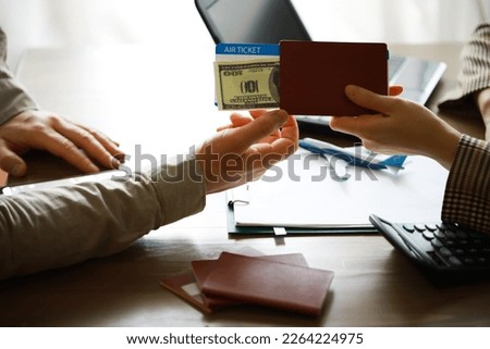 Travel agent receiving money from client for provided service