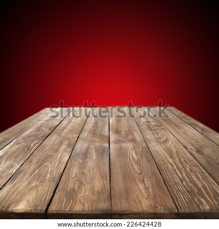red wall and empty wooden table 
