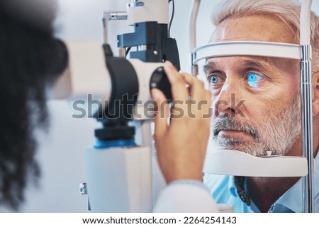 Ophthalmology, medical and eye exam with old man and consulting for vision, healthcare and glaucoma check. Laser, light and innovation with face of patient and machine for scanning and optometry Royalty-Free Stock Photo #2264254143