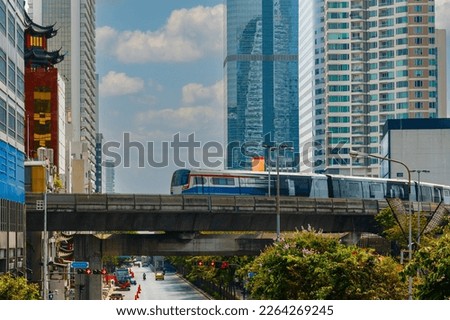 BTS Skytrain, Electric train, running on the way with business office buildings on the background.
 Royalty-Free Stock Photo #2264269245