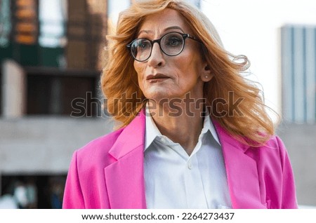 Transgender business woman lifestyle moments in downtown, Los angeles. Lgbt woman going to work at  the office. Representation of equality and working rights for the lgbtq+ community.