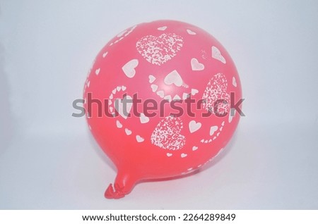 isolated red balloon with white love image on white background