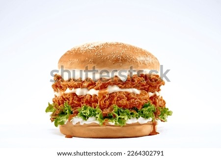 Double Chicken burger with ketchup, cheese, and mayonnaise on isolated white background. Royalty-Free Stock Photo #2264302791