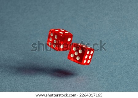 Random number generator. Two red dice with numerical values lie in a chaotic order. Royalty-Free Stock Photo #2264317165