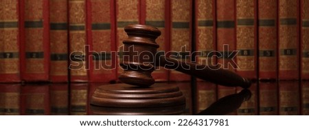 Law and justice concept. Mallet gavel of the judge, scales of justice, books. Copy space for text.