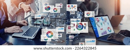 Multinational people working in office and digital documents concept. Business strategy. Wide angle visual for banners or advertisements.