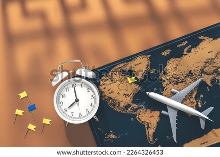 Alarm clock, airplane miniature and world map on brown background, flat lay.