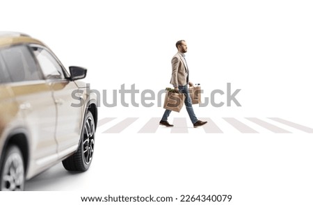 Man with grocery bags walking on a pedestrian crossing and suv waiting isolated on white background
