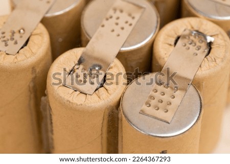 Environment Ideas. Closeup of Bundle of Soldered Ni-Mh Rechargeable Batteries  Placed Together Over Beige.Horizontal Image Royalty-Free Stock Photo #2264367293