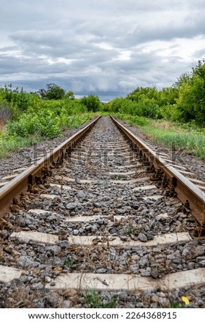 Photography to theme railway track after passing train on railroad, photo consisting of long railway track before fast movement train by railroad, railway transportation track for train at railroad