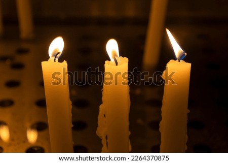 Close up of three candles in a church