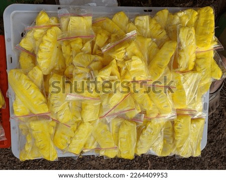 One common food sold on the streets is marinated pineapple slices