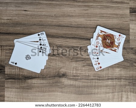 Two sets of playing cards. Card game setup on wooden table