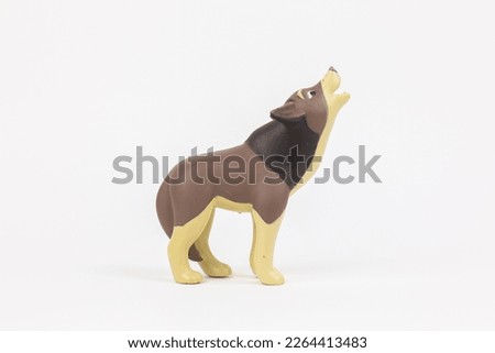 a figure of a wolf children's toy on a white background