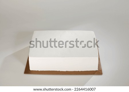 Round and rectangle cake Top view White background Mock up cake Royalty-Free Stock Photo #2264416007