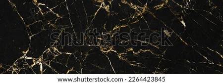 Close up of a black marble background. abstract marbel artificial stone texture with veins and golden glitter, trendy wallpaper. artificial marble stone textures and shiny golden metallic foil.