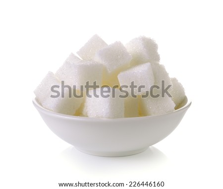 Sugar cubes in a bowl isolated on white background Royalty-Free Stock Photo #226446160