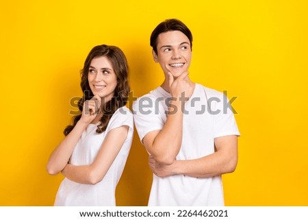 Photo portrait of thoughts youngster couple people touch chin look minded smart wear stylish white t-shirts promo isolated on yellow color background