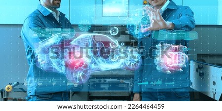 Engineer with AI factory system production line. Engineering smart EV car factory automated machine AR augmented reality technology futuristic robot control future industrial concept Royalty-Free Stock Photo #2264464459