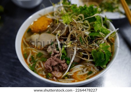Delicious Bun Bo Hue with full veggies toppings