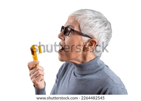 Senior Woman using Spirometer. Isolated, Transparent Background Royalty-Free Stock Photo #2264482545